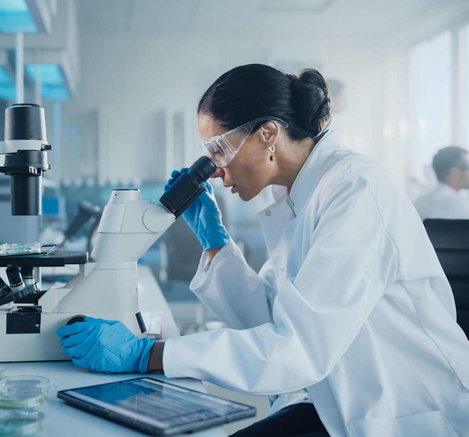 Medical Development Laboratory: Caucasian Female Scientist Looki