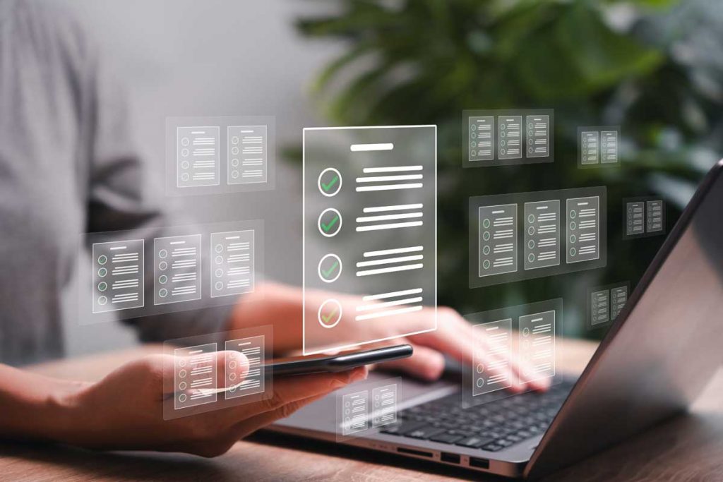 hands typing at a laptop keyboard with check boxes overlaid