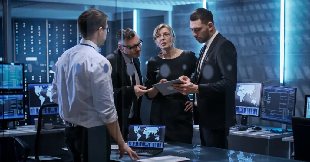 people ion a modern office discussing IT